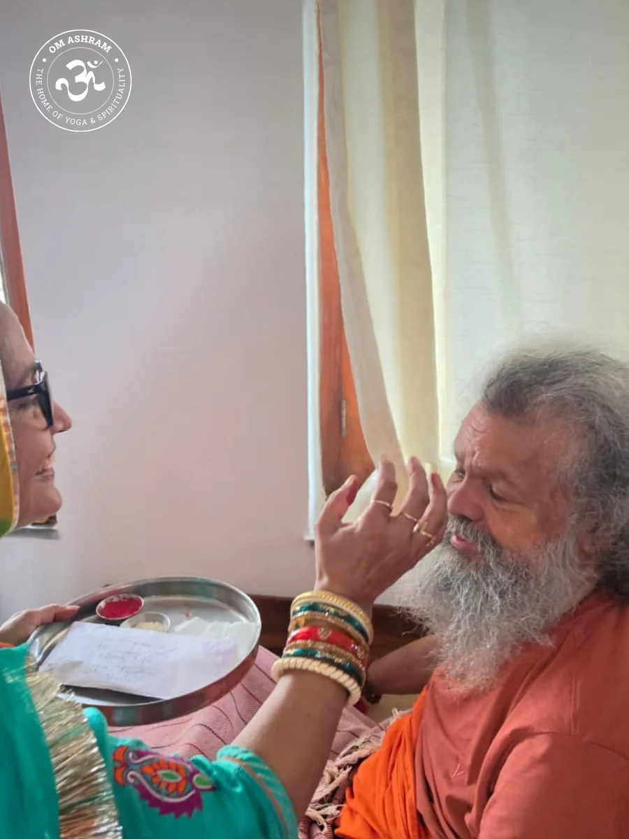 Placing sacred Tilak.